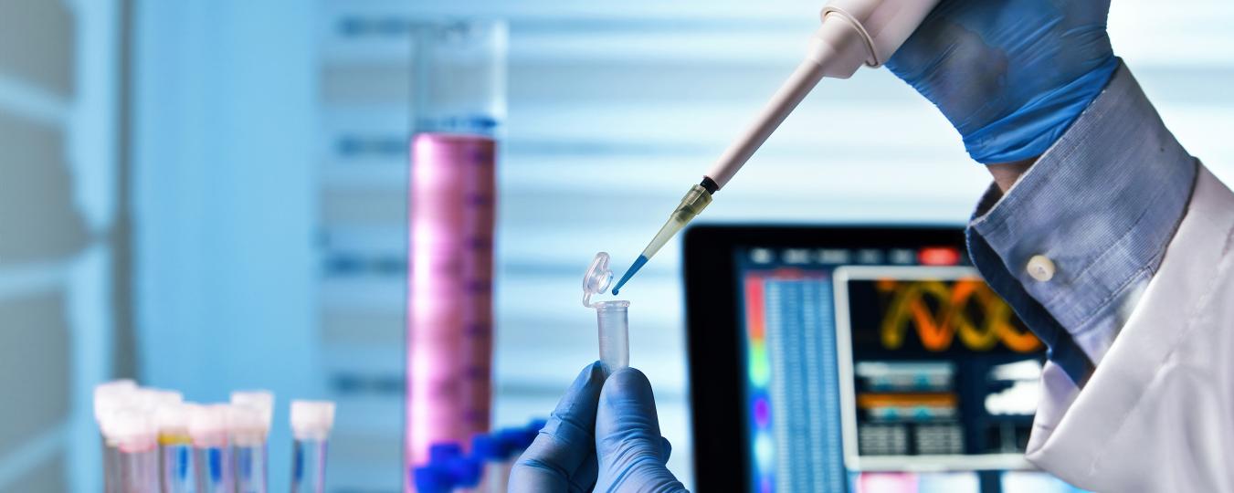 A person conducting biomedical research in a lab