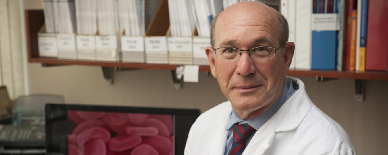 Photo of Dr. Jeffrey Carson in a lab coat