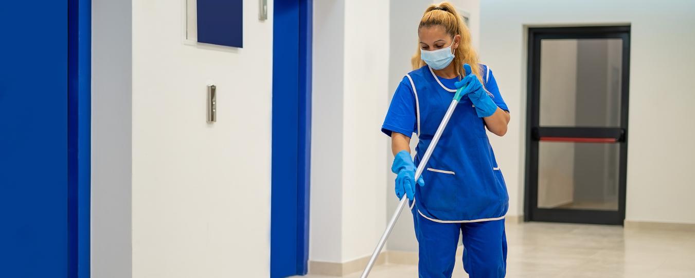 A woman cleans a floor