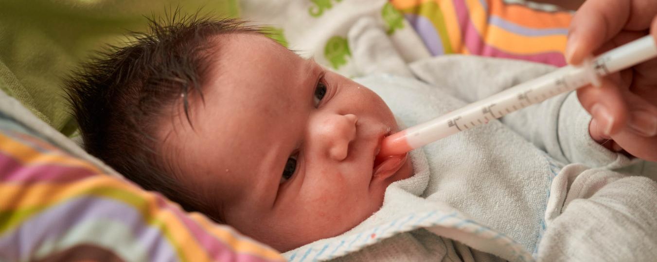 Newborn receiving antibiotics