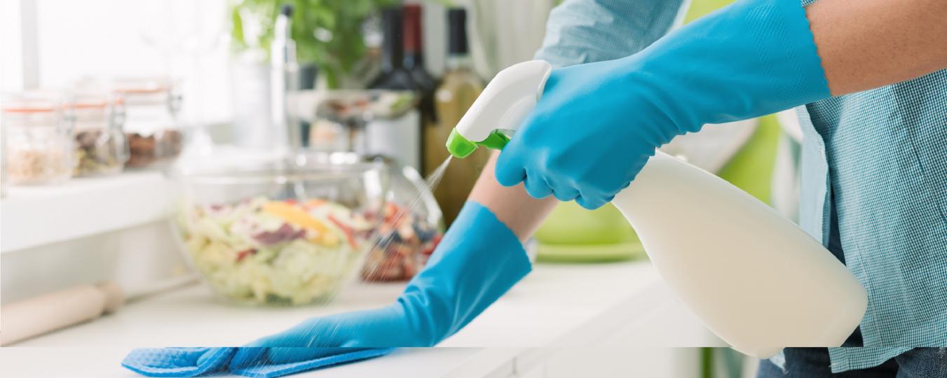 Person cleaning countertop