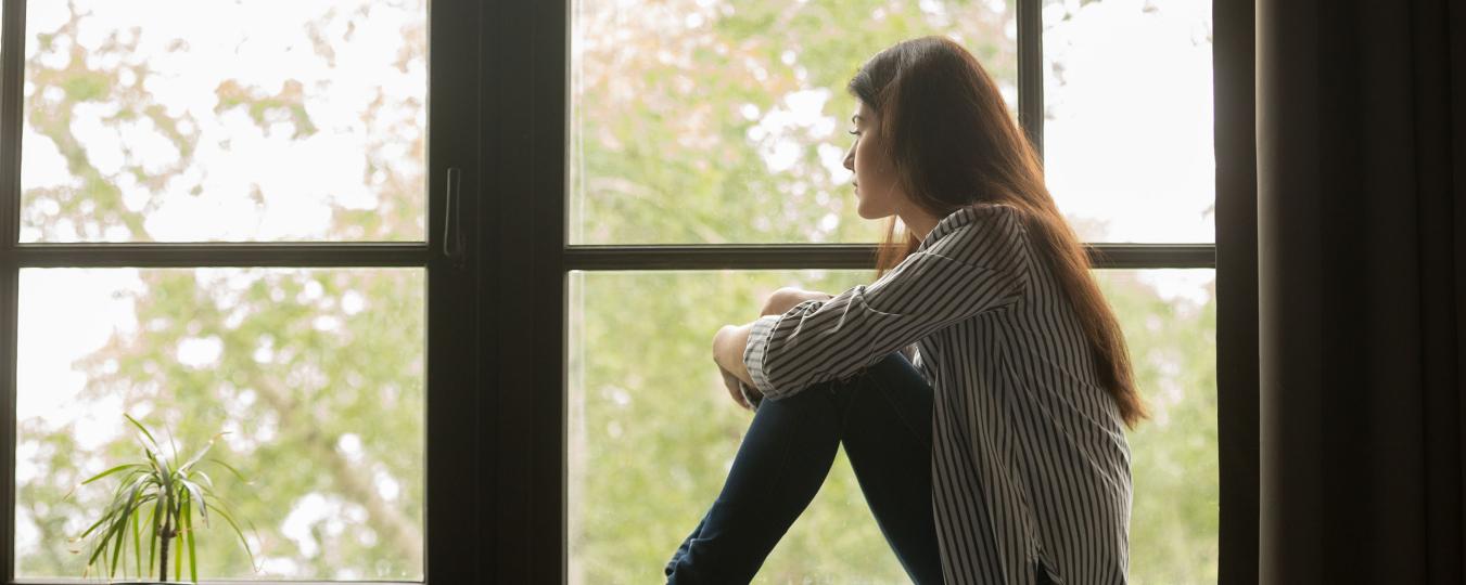 Woman sitting in a window seat