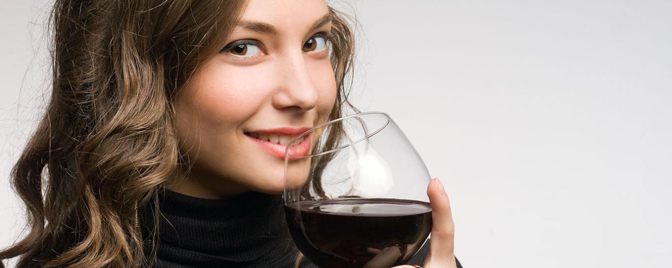 Young woman drinking wine