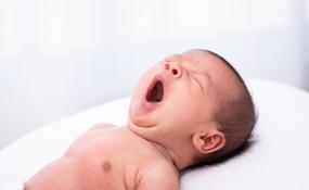 A baby yawns